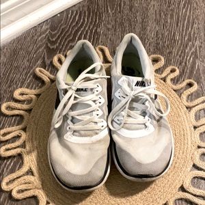 White Nike running shoes